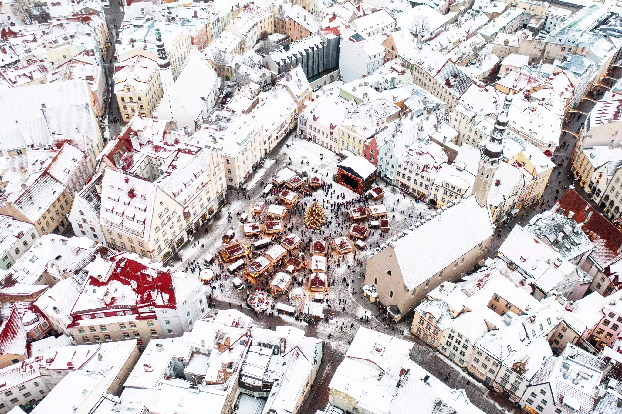 Aerial View of Tallinn Old Town the Town Hall Square in winter. View from above to the center part of capital of Estonia.