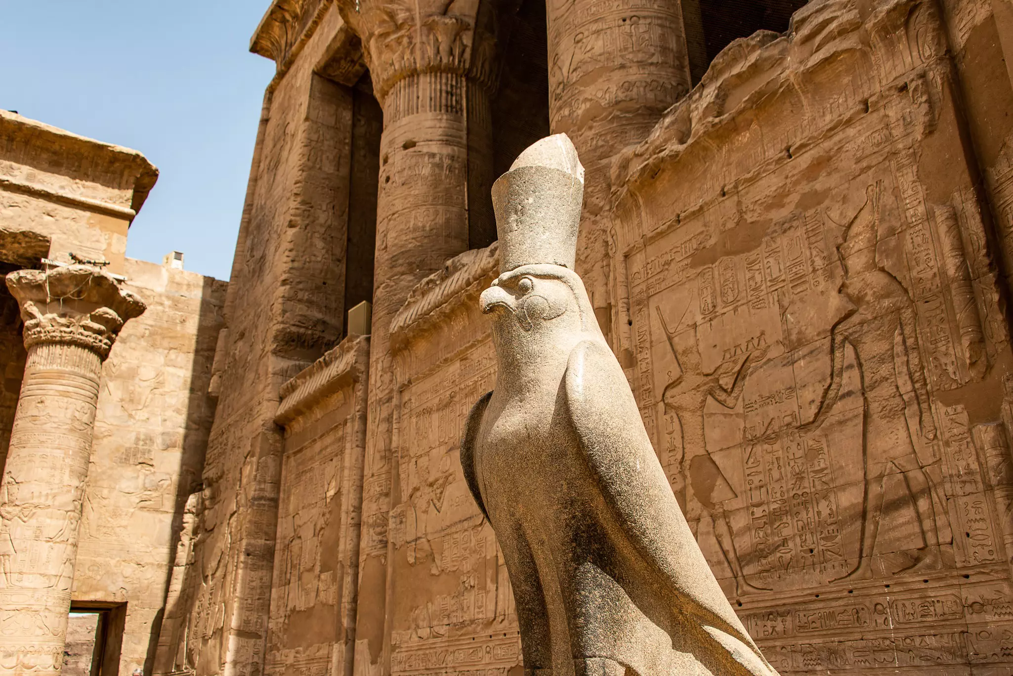 Carvings, statues and heiroglyphs at the Temple of Horus in Edfu, Egypt.