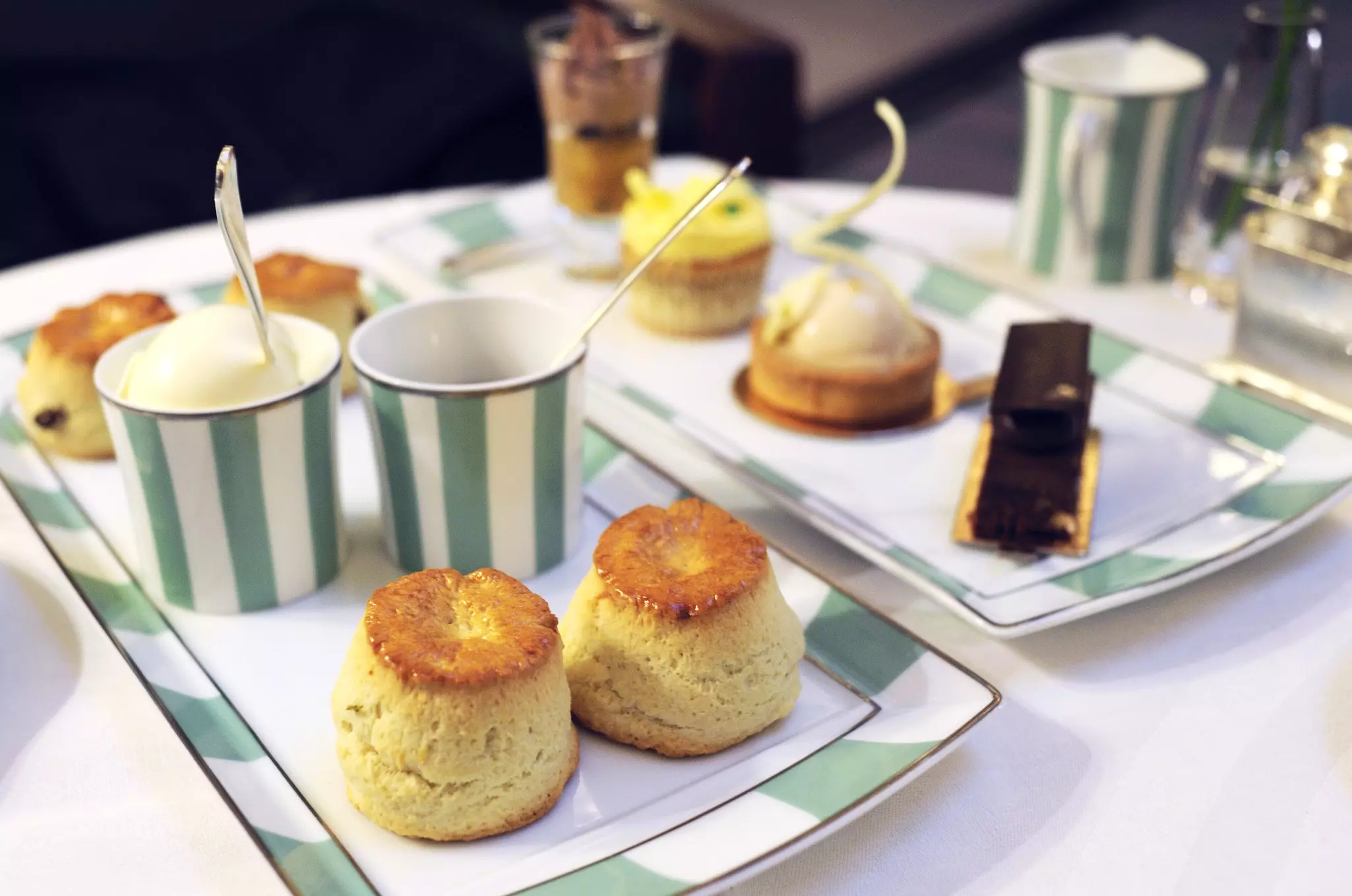 Apple scones and other desserts during afternoon tea at The Foyer, Claridge's Hotel, London.
