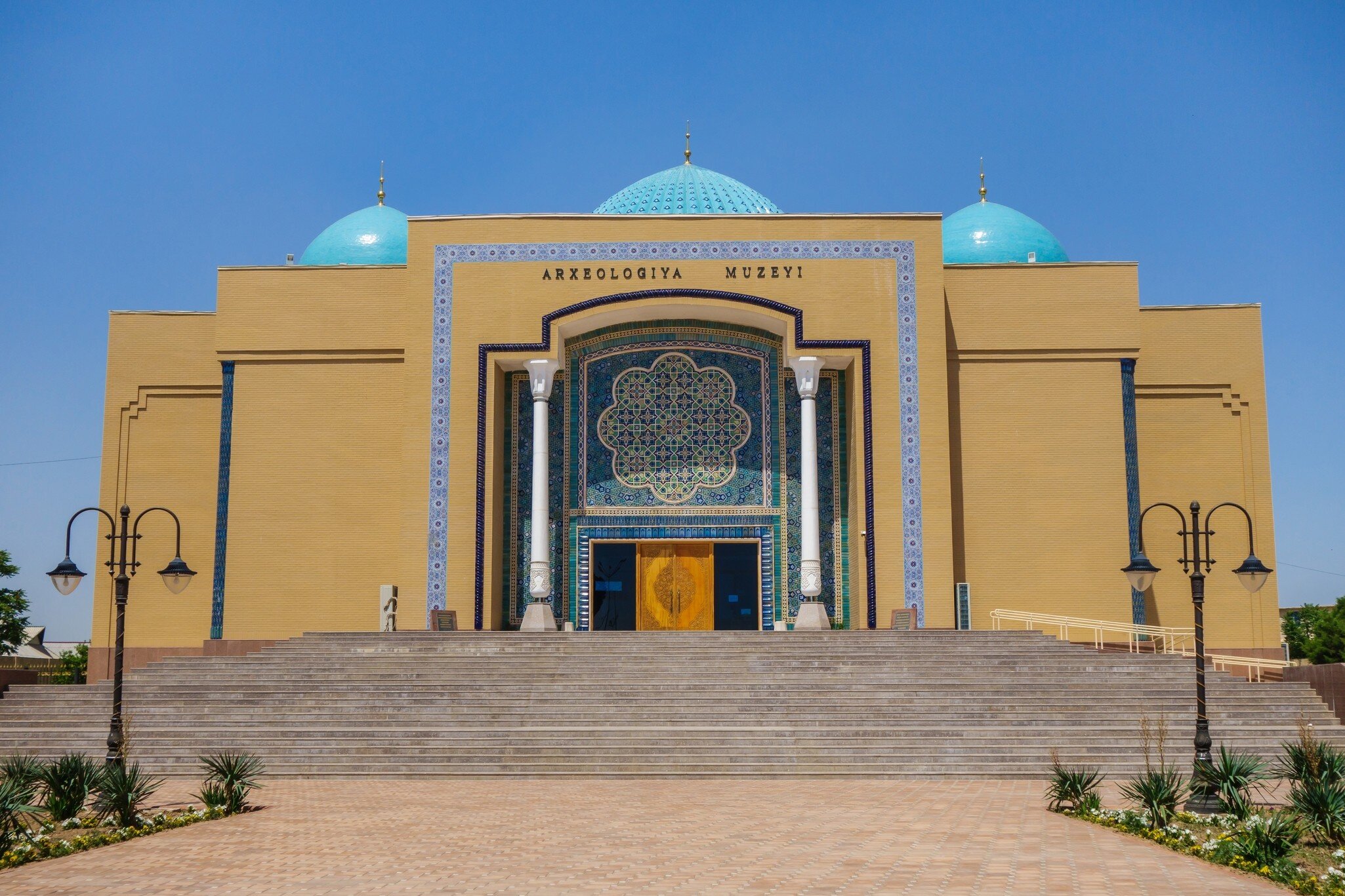 Museum building in the city of Termez, Uzbekistan. Here are collected objects of deep antiquity, including Buddhist and Zoroastrian. The inscription translates as 'Archaeological Museum'; Shutterstock ID 2070114383;