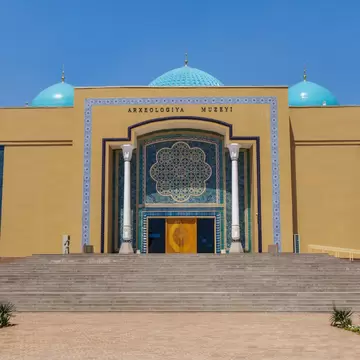 Museum building in the city of Termez, Uzbekistan. Here are collected objects of deep antiquity, including Buddhist and Zoroastrian. The inscription translates as 'Archaeological Museum'; Shutterstock ID 2070114383;