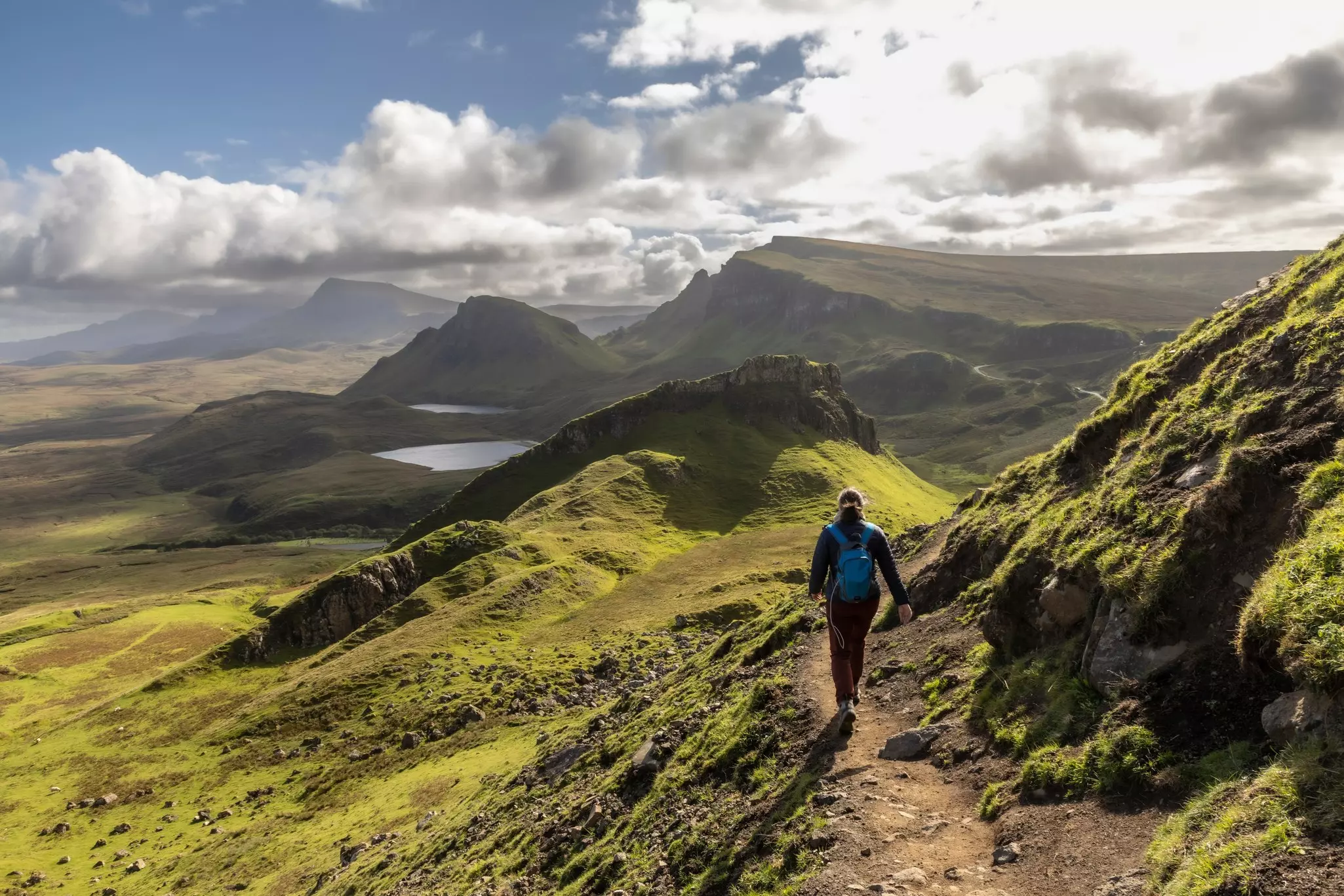 Woman hiking the Quiraing on the Scottish Isle of Skye, Scotland.