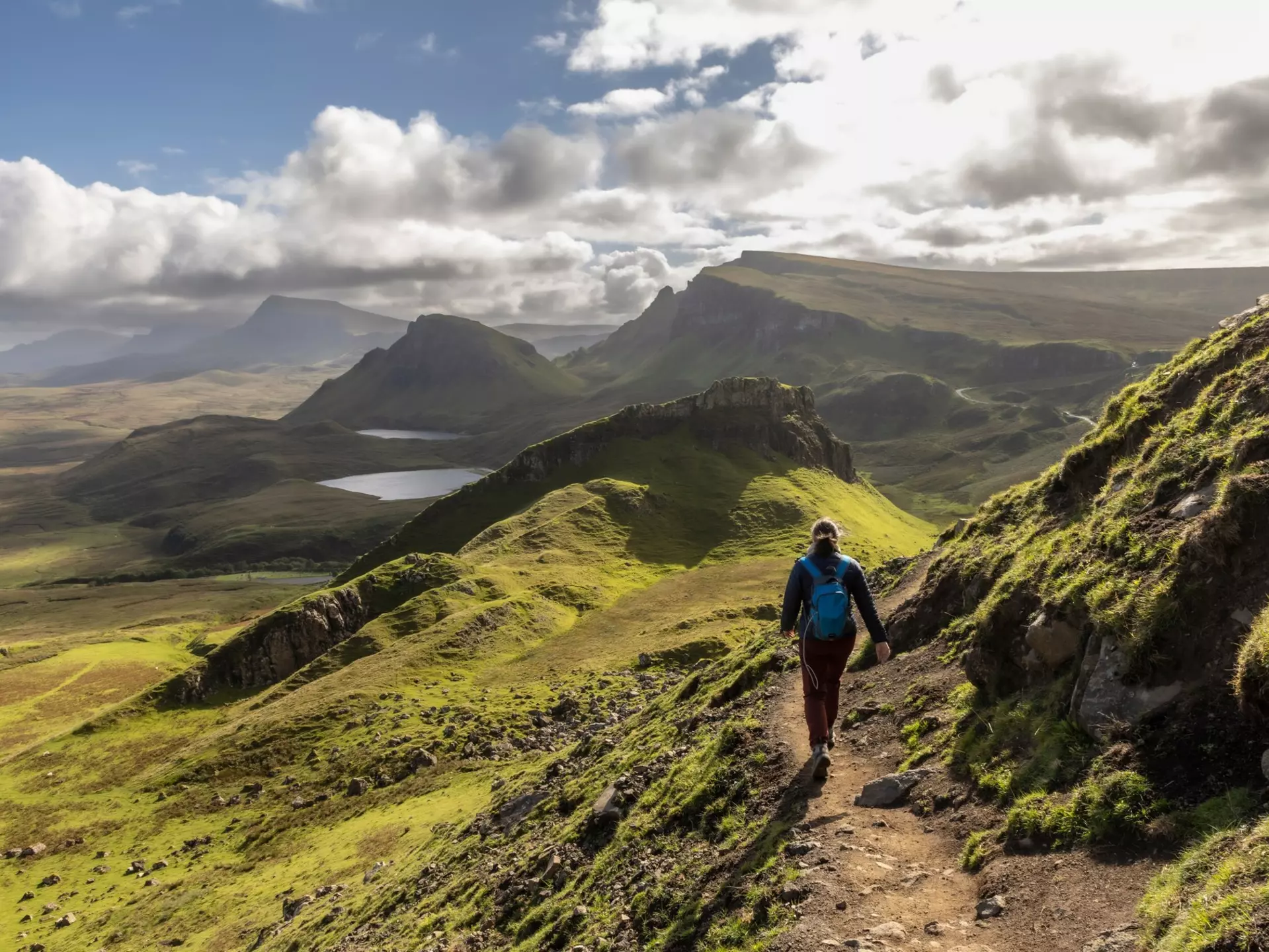 Woman hiking the Quiraing on the Scottish Isle of Skye, Scotland.