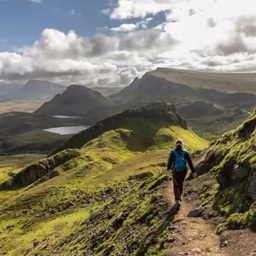 Woman hiking the Quiraing on the Scottish Isle of Skye, Scotland.