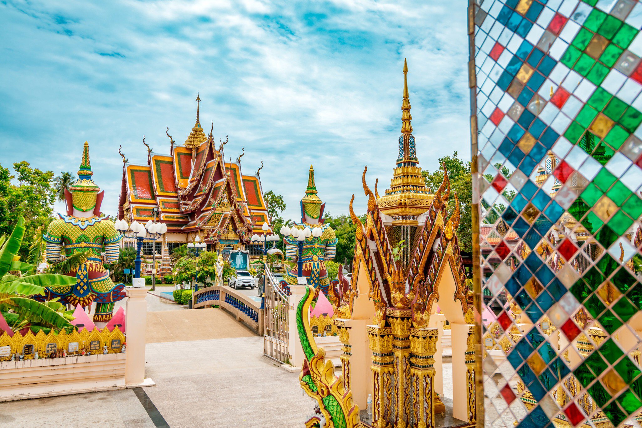 Wat Plai Laem Buddhism Temple statues during a sunny day in Koh Samui.