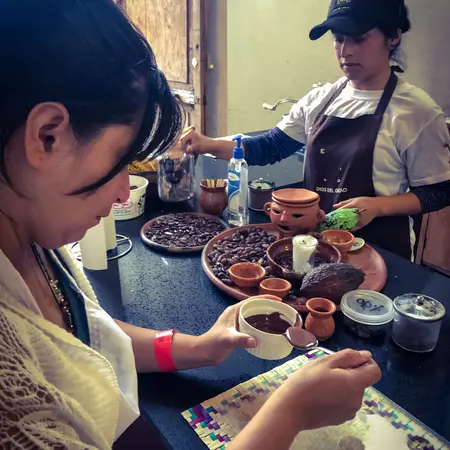 A woman participating to a chocolate making class.   
