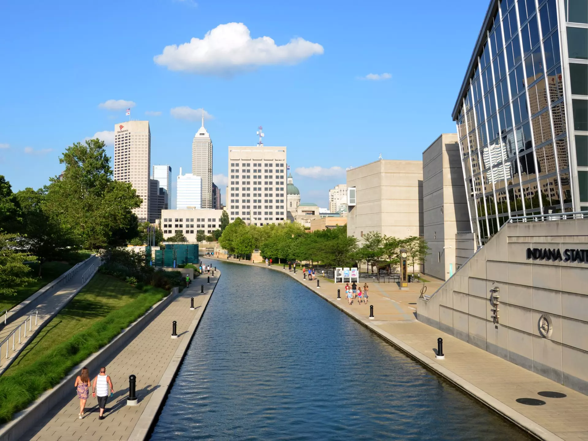Indianapolis, IN, USA - June 17, 2014: Indianapolis skyline seen from Canal Walk near the Indiana State Museum June 17, 2014. The three mile loop is a popular walking and jogging trail in downtown Indianapolis.
499206903
Travel, Leisure Activity, Cycle, City Life, Downtown District, Indianapolis, Midsection, Walking, Sidewalk, Exercising, Healthy Lifestyle, Choice, Environment, Transportation, Lifestyles, Urban Scene, Outdoors, Recreational Pursuit, Tourist, People, Indiana, USA, Water, Station, Canal, Urban Skyline, City, Town, hire, Riding