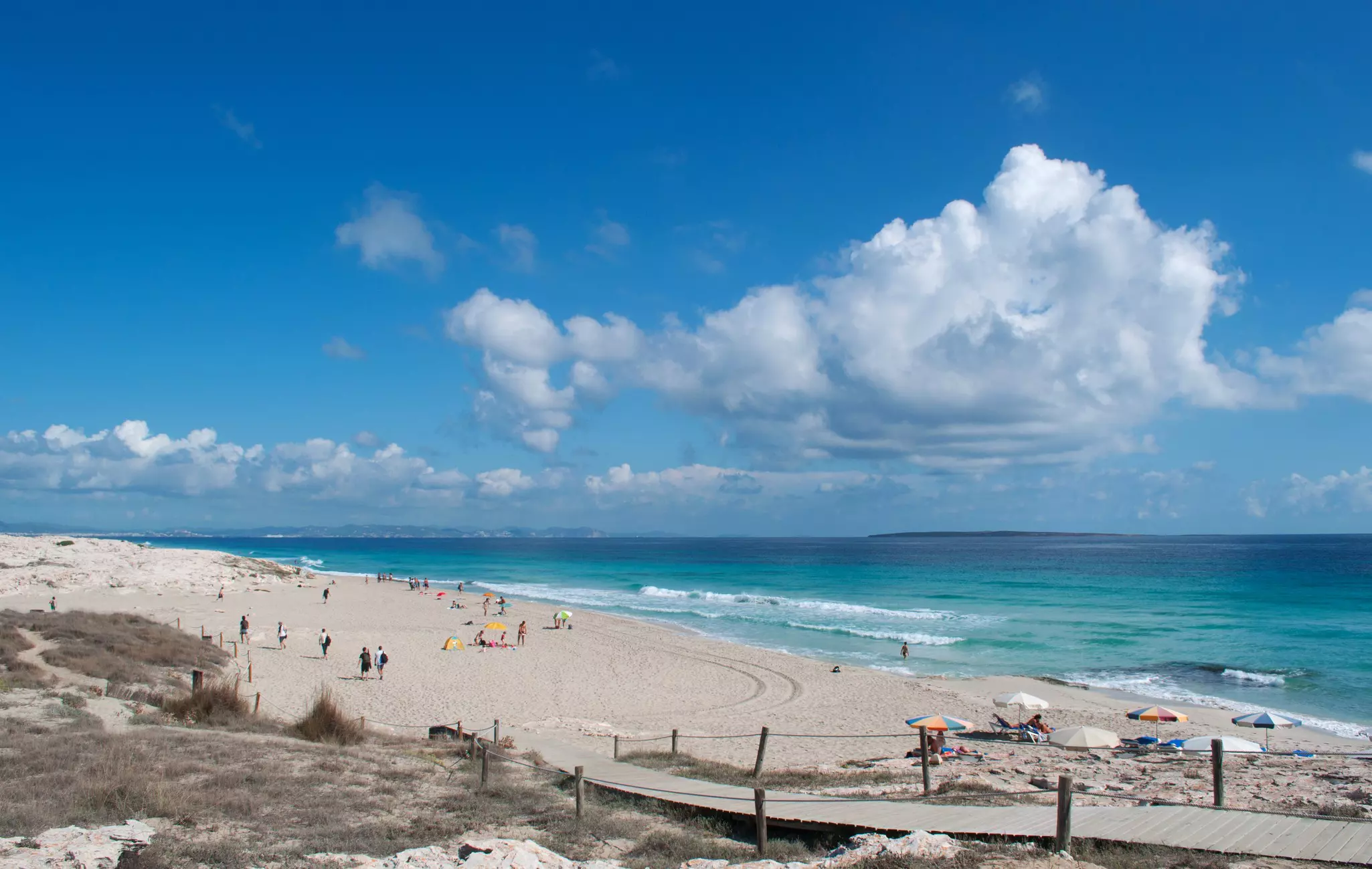 Formentera, Spain, 09/06/2010: aerial view of the breathtaking beach of Platja (Playa) de Llevant, on the eastern side of the Trucador peninsula, one of the most famous and quiet beaches of the island; Shutterstock ID 472271677;