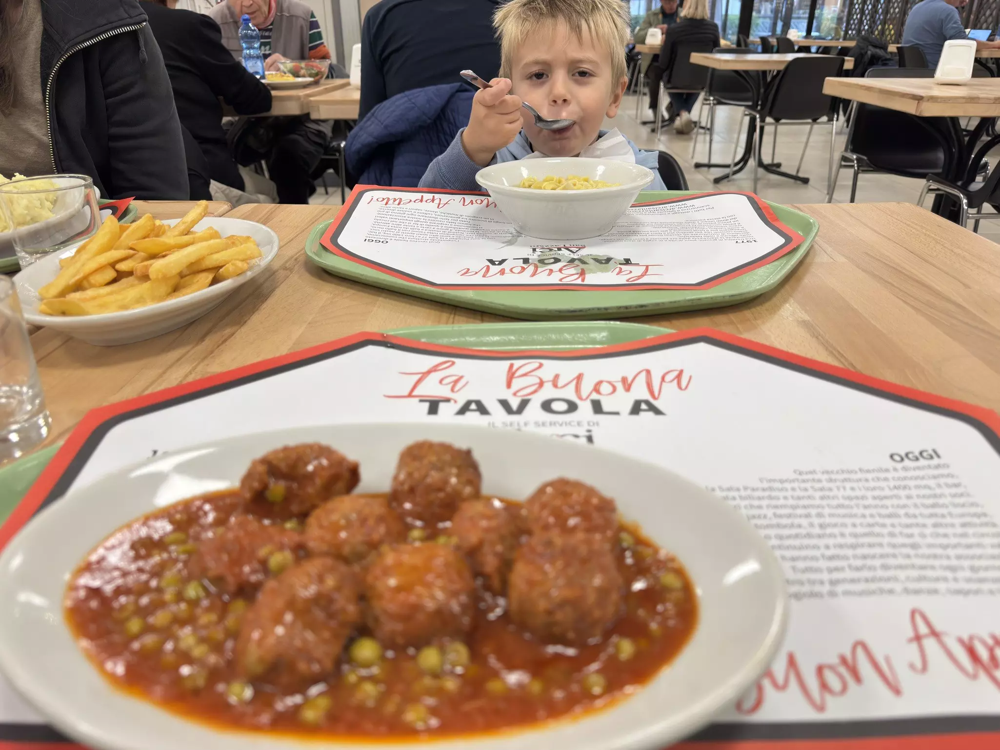 Meatballs and peas and Kevin's son at ARCI San Lorenzo in Bologna Italy