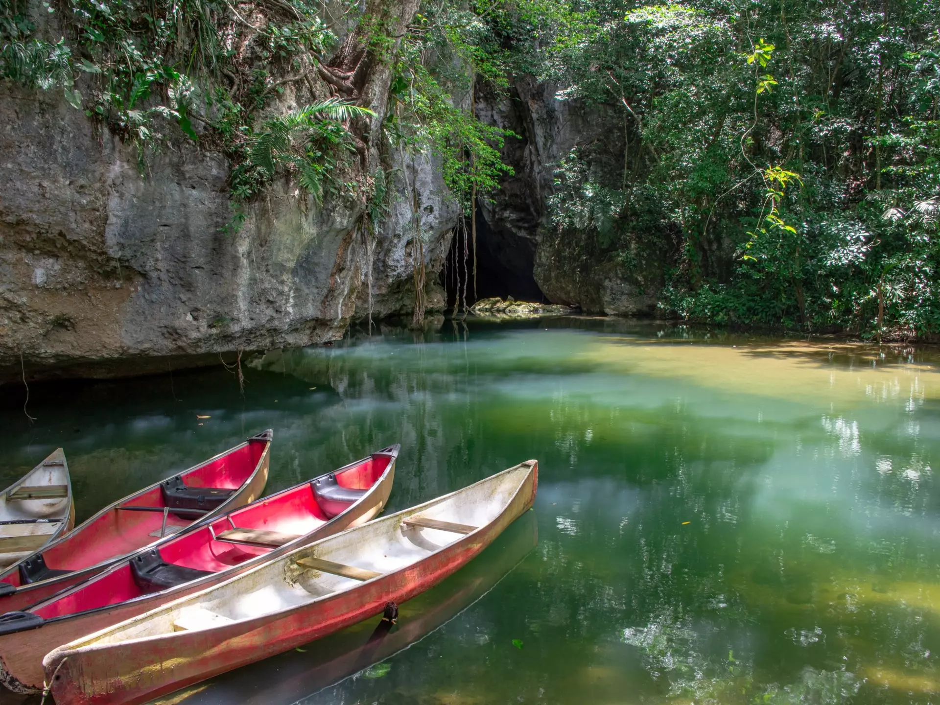 Canoes at the entrance to Barton Creek Cave in the Cayo District of Belize.
