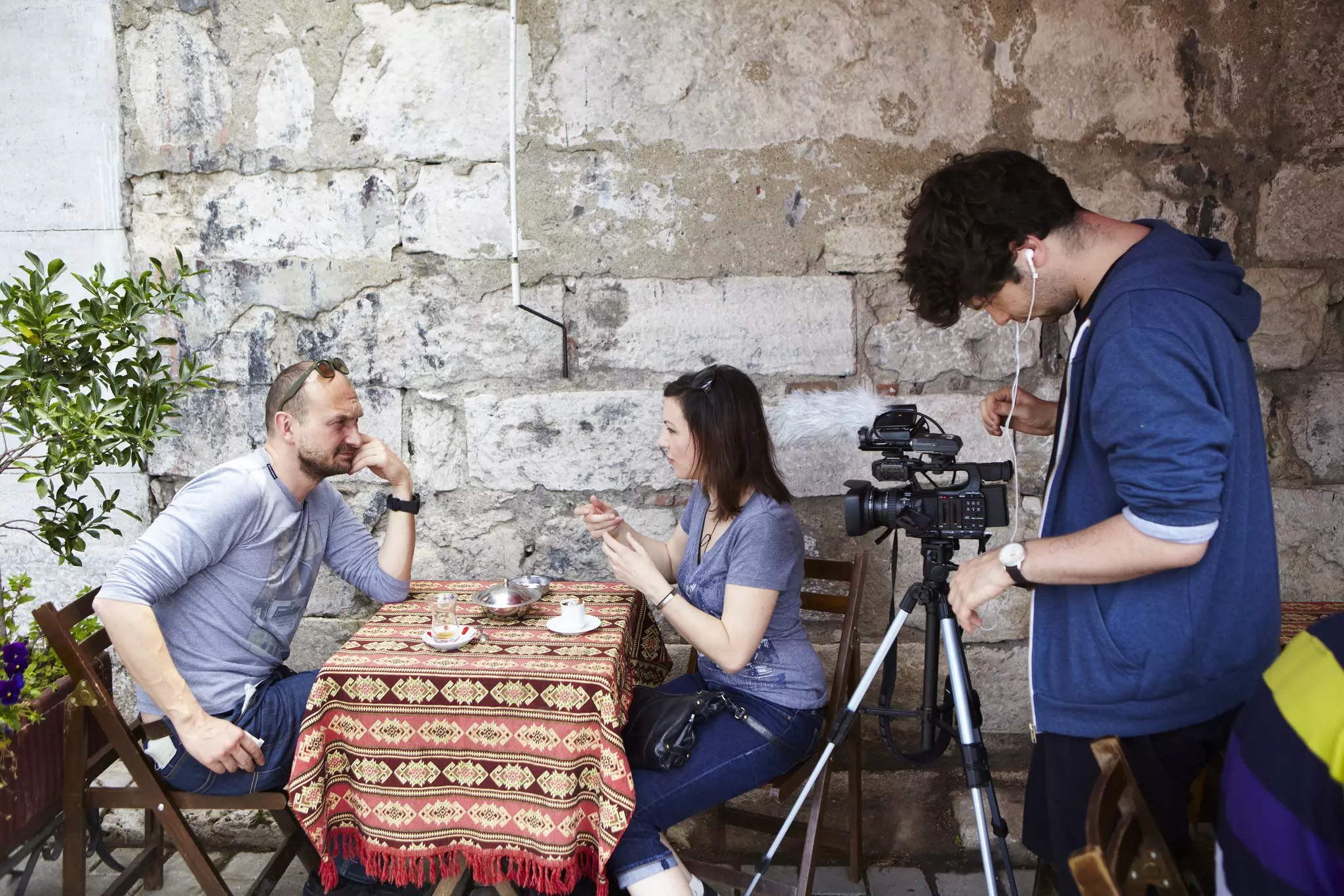 Oliver Smith and Christa Larwood interviewing man at table.
Lonely Planet Traveller Magazine, acrosstheplanet, Extras