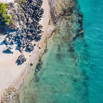 Azure seas over a rock shelf at low tide on Cape Wirrawoi, Northern Territory. Craig Ramsay / 500px