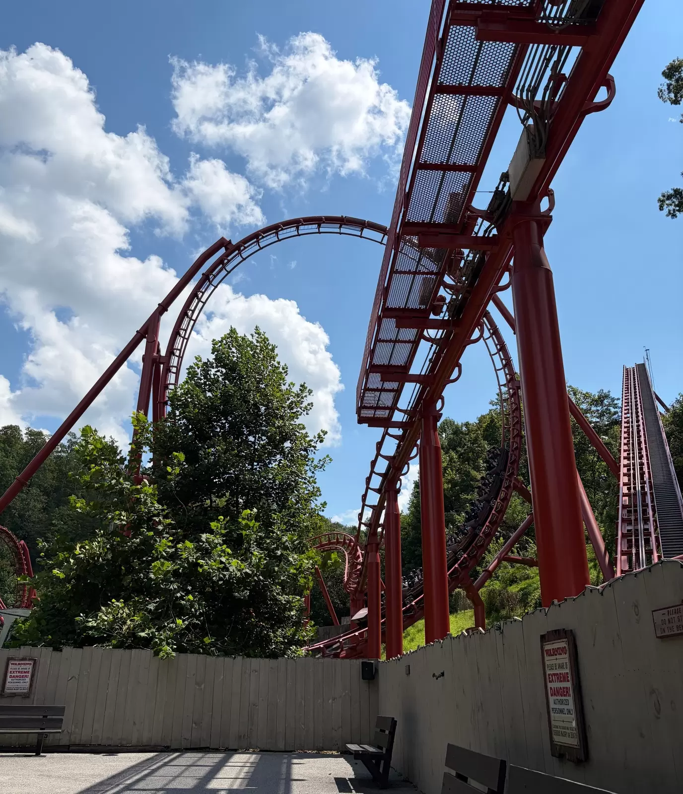 a rollercoaster at a theme park - view from the ground up