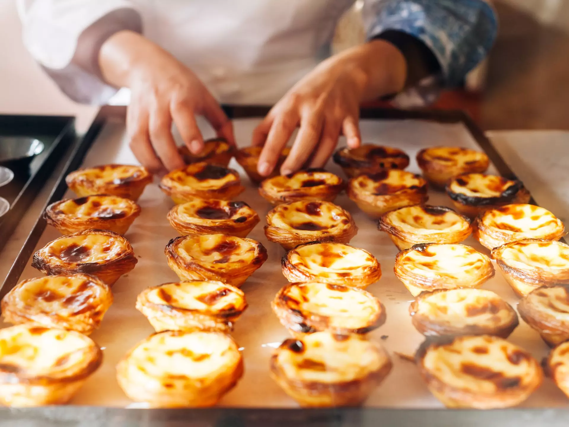 Wondering where to get the best pastéis de nata in Lisbon? We've got you covered. StrelnikAnd / Shutterstock