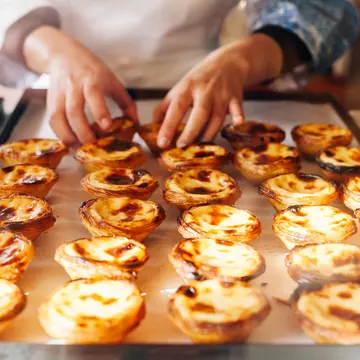 Wondering where to get the best pastéis de nata in Lisbon? We've got you covered. StrelnikAnd / Shutterstock