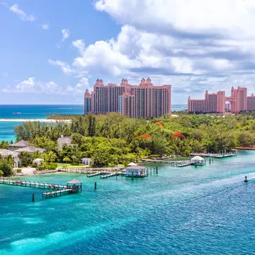 Paradise island with the Atlantis Resort at the background, Nassau, Bahamas Awesome Atlantis Resort on Paradise island in the island of Nassau, in the heart of the Caribbean sea in a sunny summer day.  License Type: media  Download Time: 2023-08-20T10:10:29.000Z  User: claramonitto  Is Editorial: No  purchase_order:   