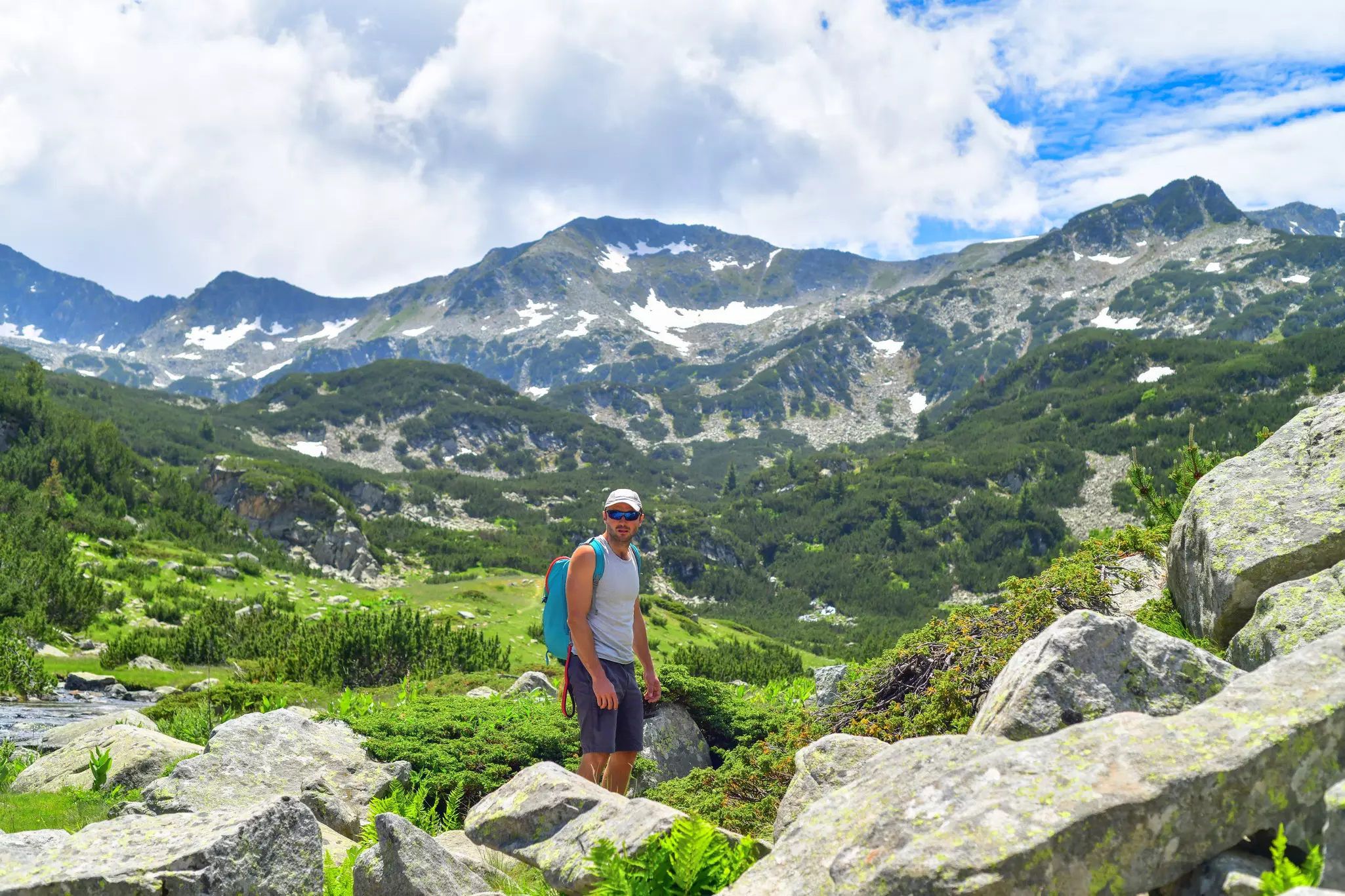 A man hikes in Pirin Mountain National Park, Bulgaria