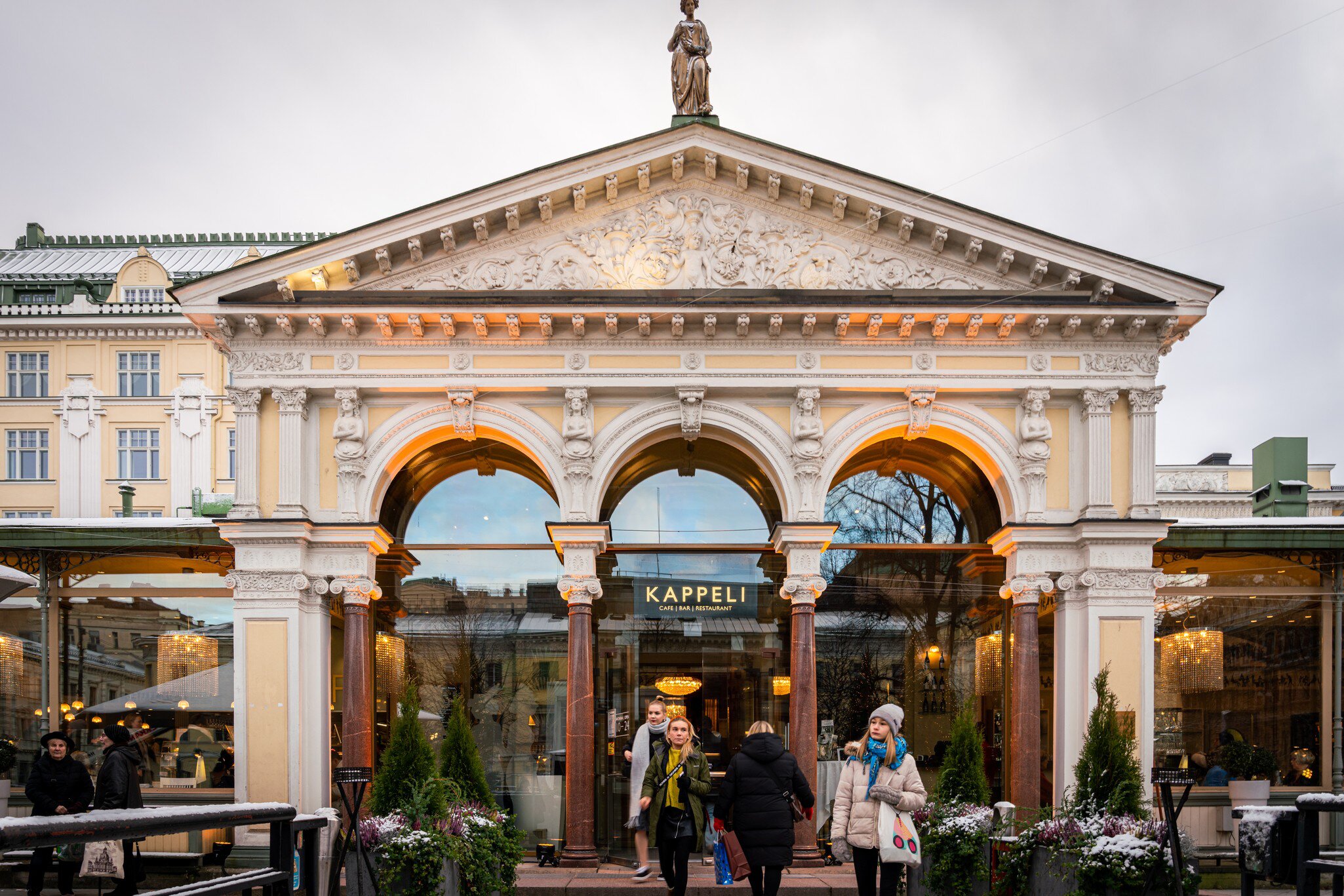HELSINKI, FINLAND - NOVEMBER 30, 2019: Front facade view of people in front of the famous Kappeli café and restaurant entrance in Helsinki Finland November 30, 2019., License Type: media, Download Time: 2026-04-16T08:11:32.000Z, User: esterpyykko45, Editorial: true, purchase_order: 65050 - Digital Destinations and Articles, job: Lonely Planet, client: app content, other: Ester Pyykko