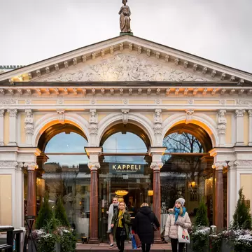 HELSINKI, FINLAND - NOVEMBER 30, 2019: Front facade view of people in front of the famous Kappeli café and restaurant entrance in Helsinki Finland November 30, 2019., License Type: media, Download Time: 2026-04-16T08:11:32.000Z, User: esterpyykko45, Editorial: true, purchase_order: 65050 - Digital Destinations and Articles, job: Lonely Planet, client: app content, other: Ester Pyykko