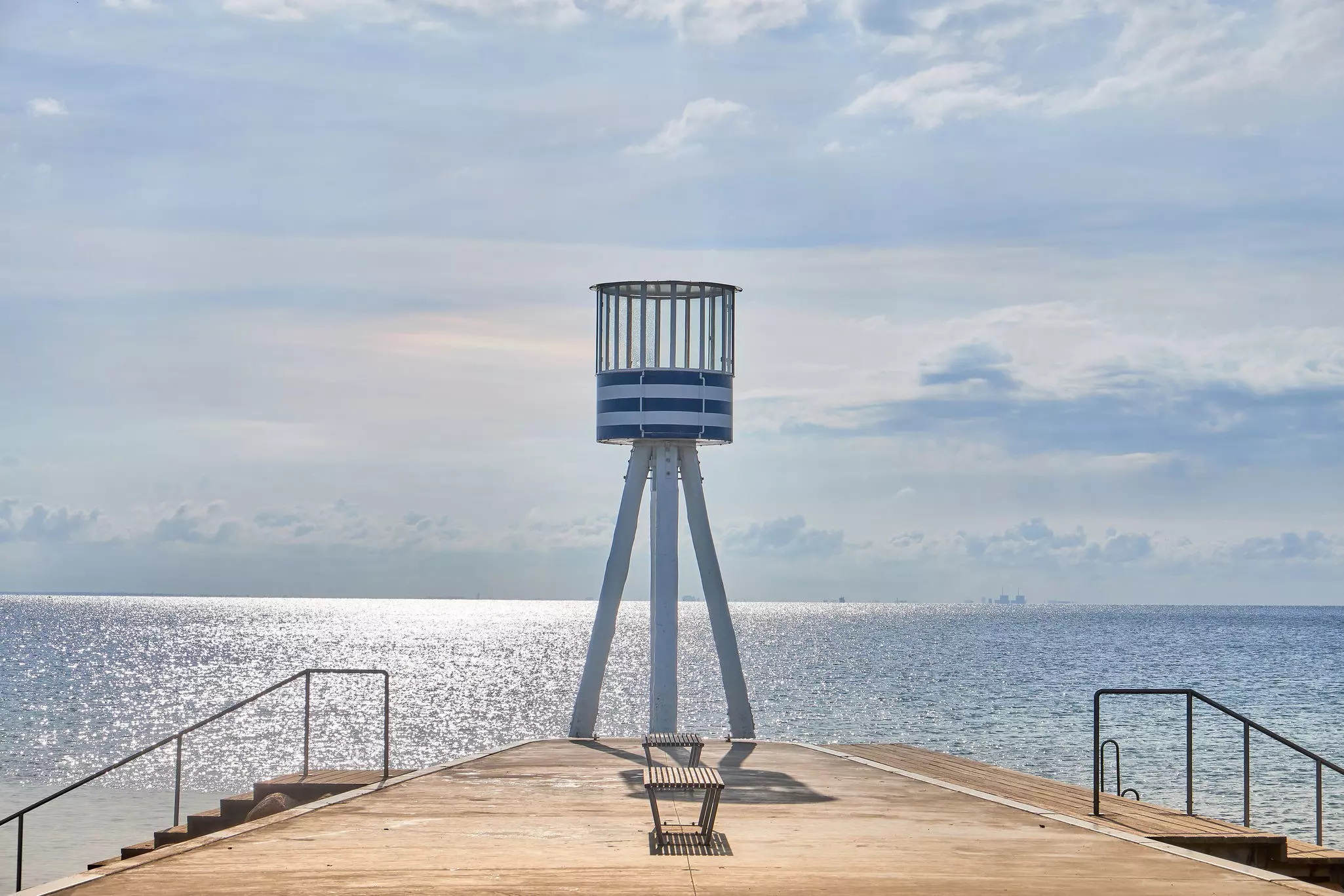 A blue and white lifeguard tower designed by Arne Jacobsen at Bellevue Beach in Copenhagen, Denmark.