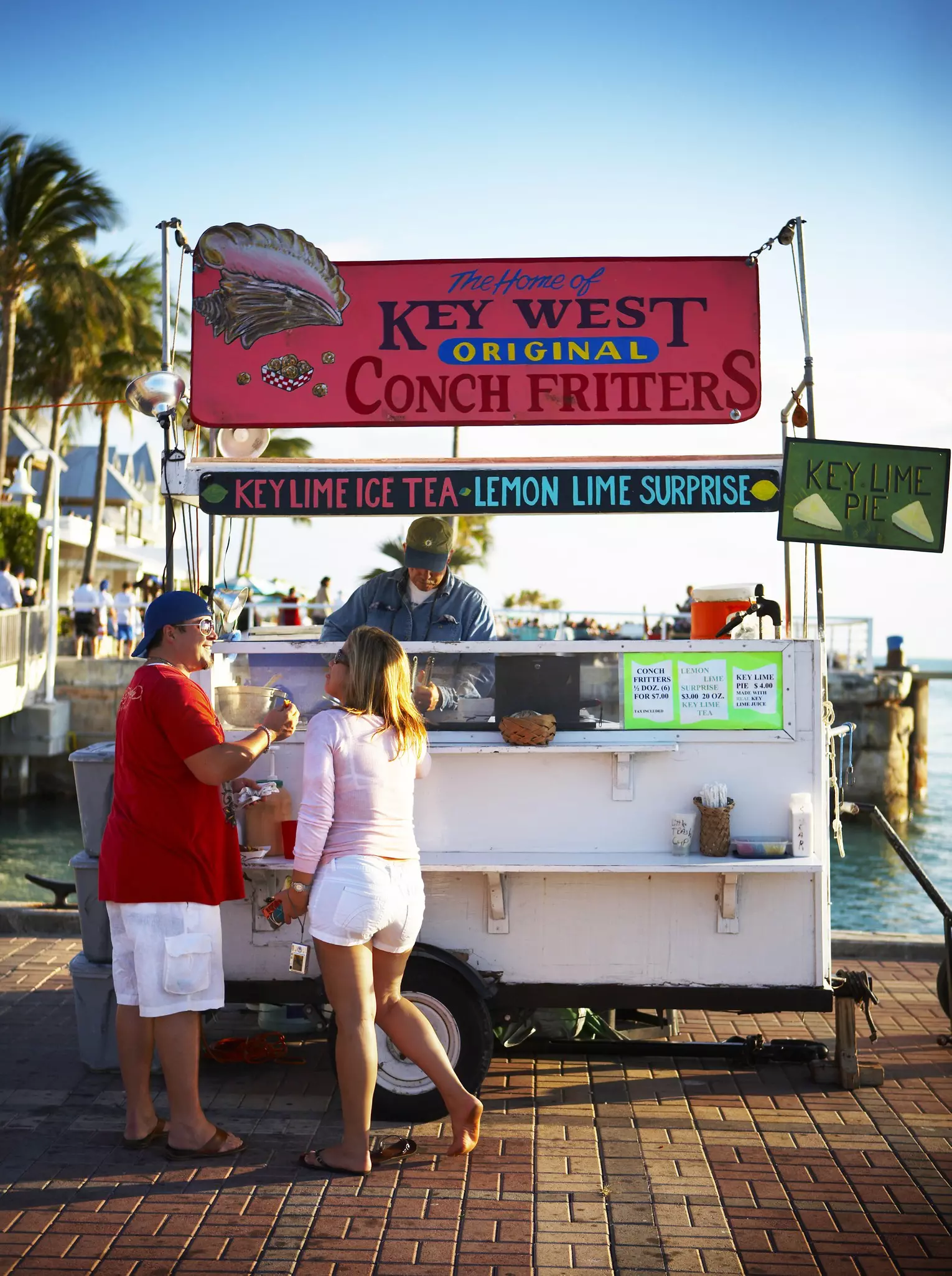 Tourists at conch fritter stand on Mallory Square