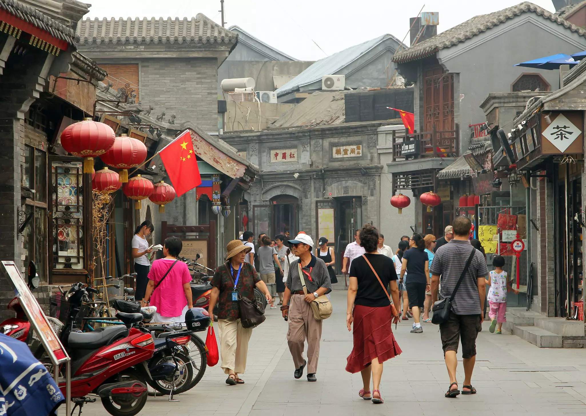 People walking on an ancient street between Shichahai area and Drum Tower, Beijing.