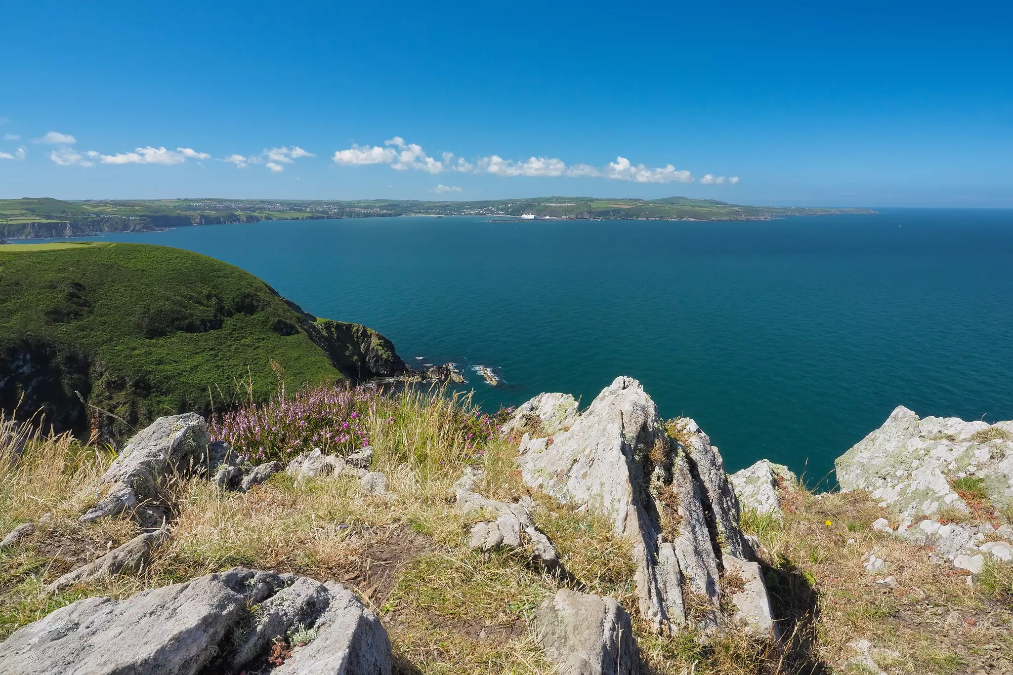 Exhilarating view from the top of Dinas Head on Dinas Island over the cliffs and coastline to Fishguard Harbour, Pembrokeshire Coast National Park, Wales, UK.