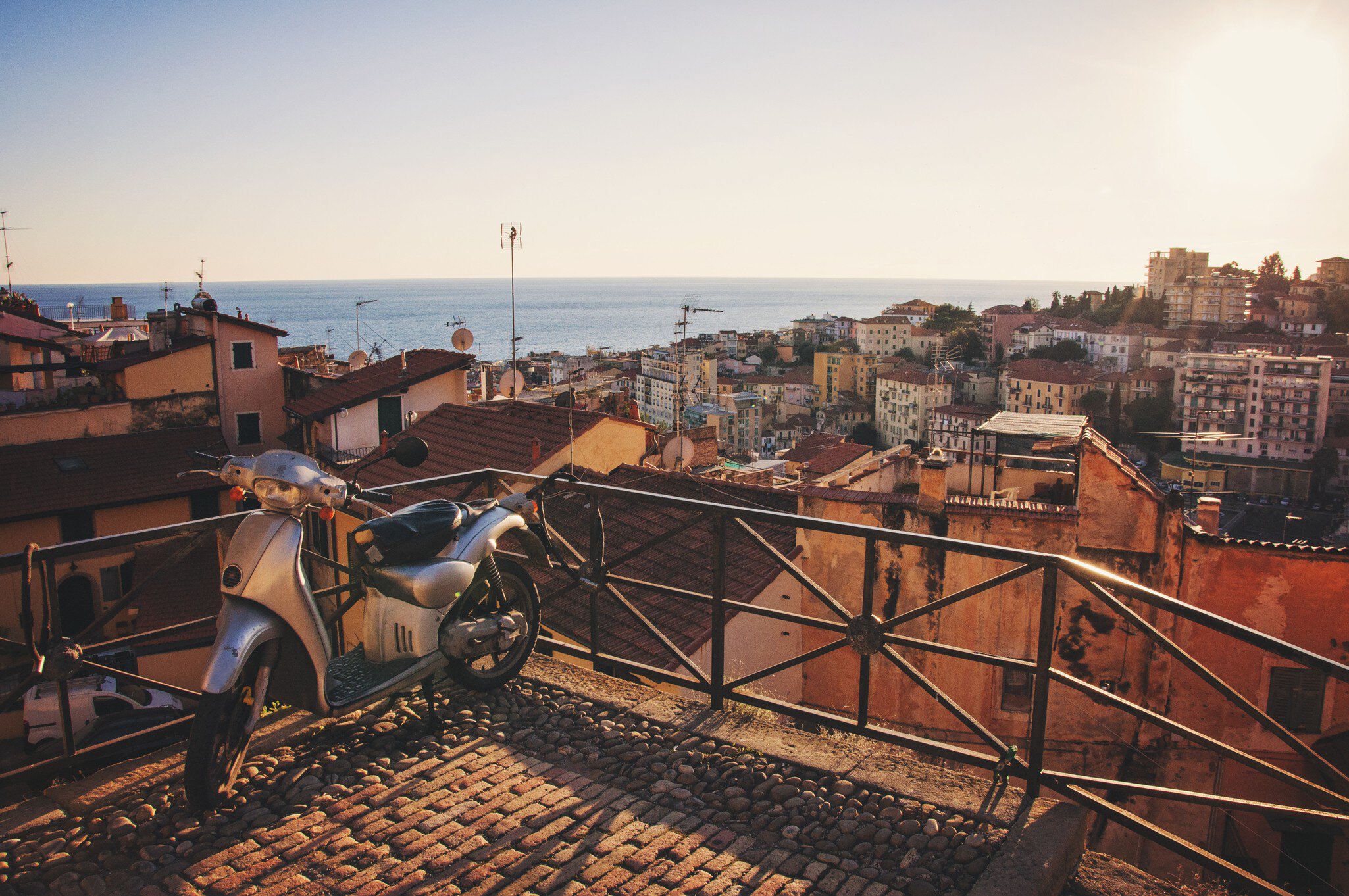 Scooter left on top of La Pigna - old town of San Remo, Italy.