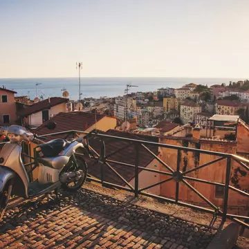 Scooter left on top of La Pigna - old town of San Remo, Italy.