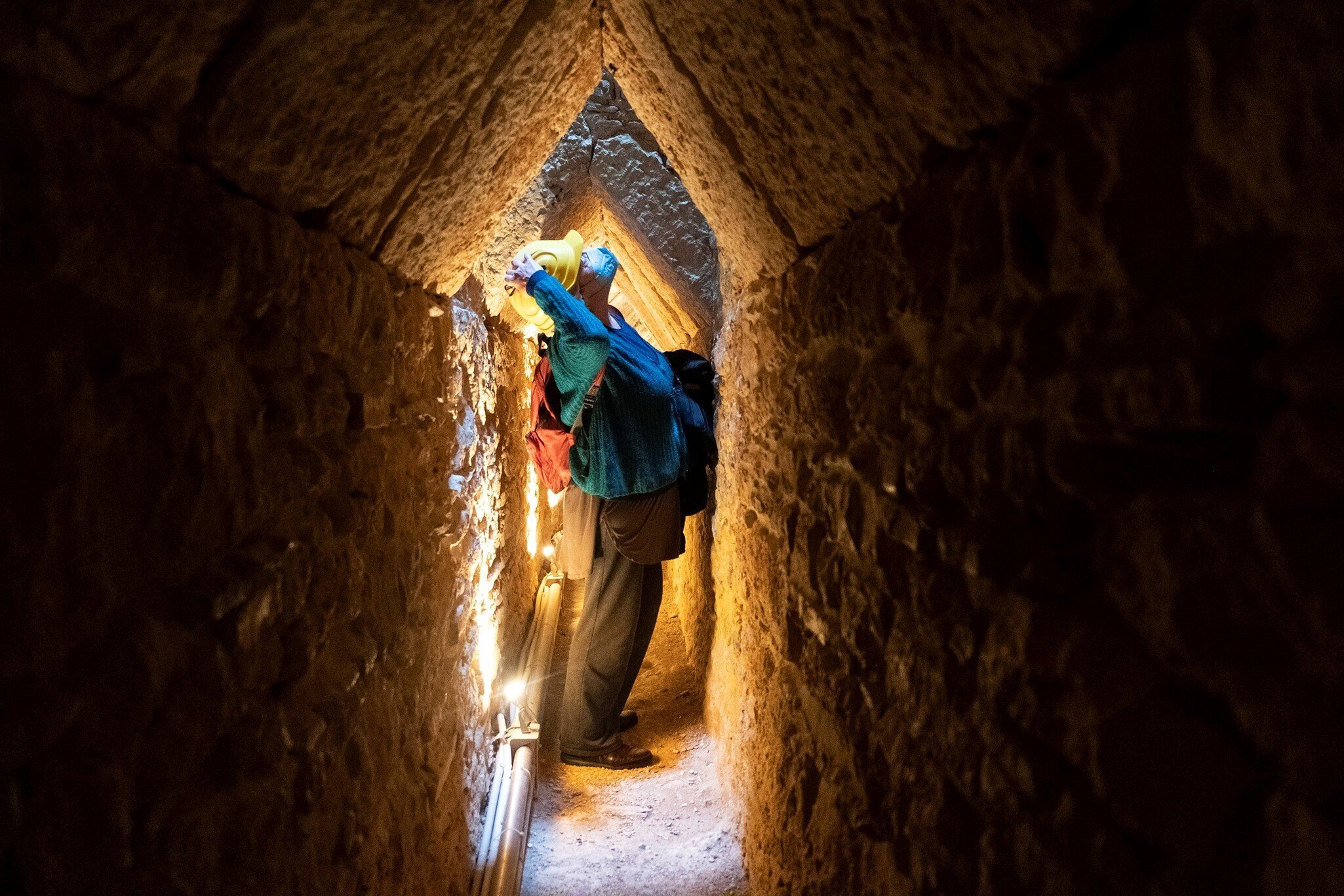Photo taken on April 18, 2022 shows a visitor in the Tunnel of Eupalinos, which is situated in Samos, an island in the eastern Aegean, Greece. The Tunnel of Eupalinos is a water pipeline running through Mount Kastro in Samos, built in the 6th cent...