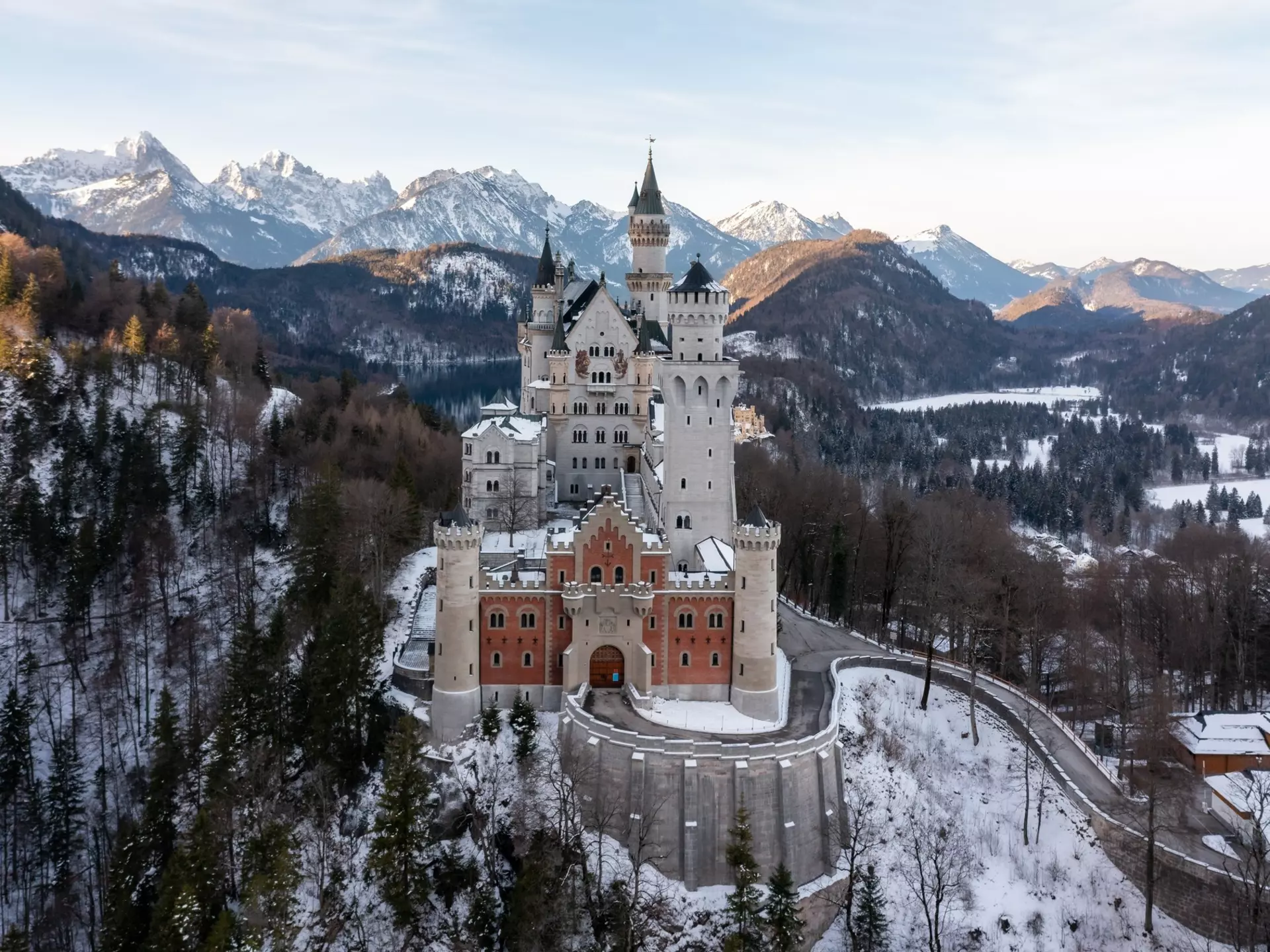 A scenic shot of the Neuschwanstein Castle in Germany surrounded by snowy mountain forests, License Type: media, Download Time: 2025-12-10T14:58:00.000Z, User: rhylton_redventures, Editorial: false, purchase_order: 65050 - Digital Destinations and Articles, job: Lonely Planet, client: social, other: Rhianydd Hylton
