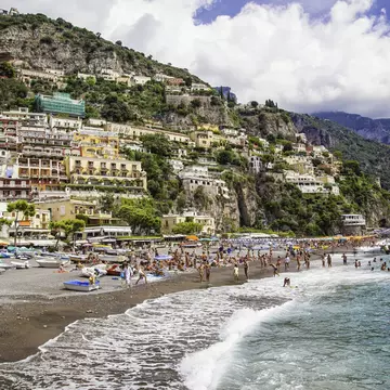 Beaches, like this one in Positano, are a relaxed place to chat to locals and other travellers. Benoit BACOU / Getty Images