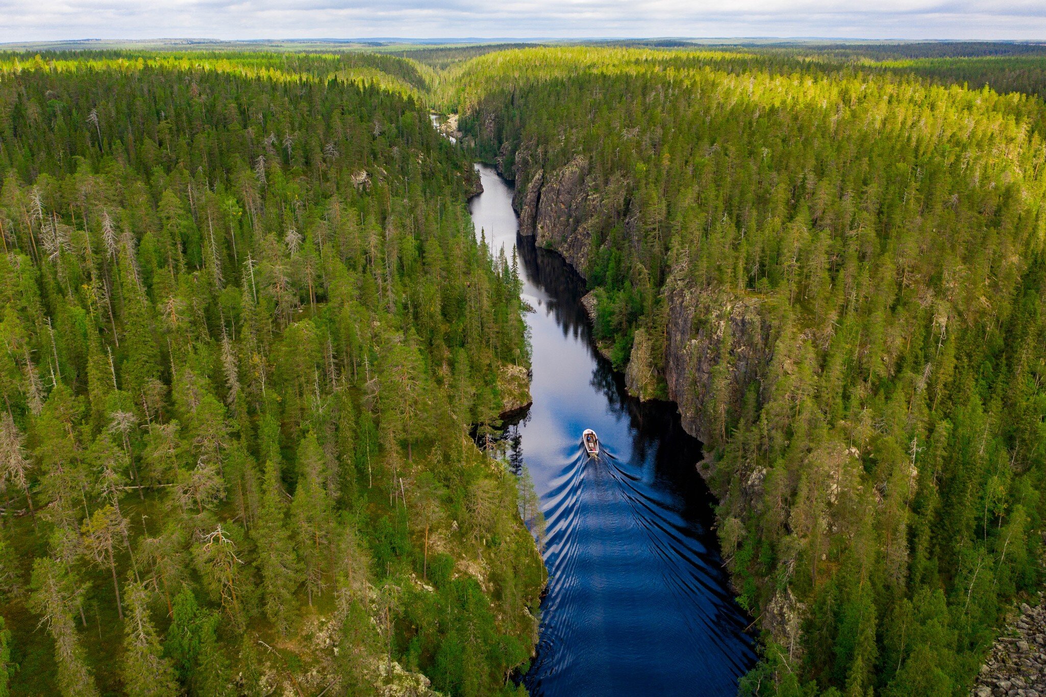 Aerial view of a boat, canyon lake and forest in Julma-Ölkky, Hossa National Park, Finland; Shutterstock ID 2023369706; purchase_order: 65050; job: ; client: ; other: