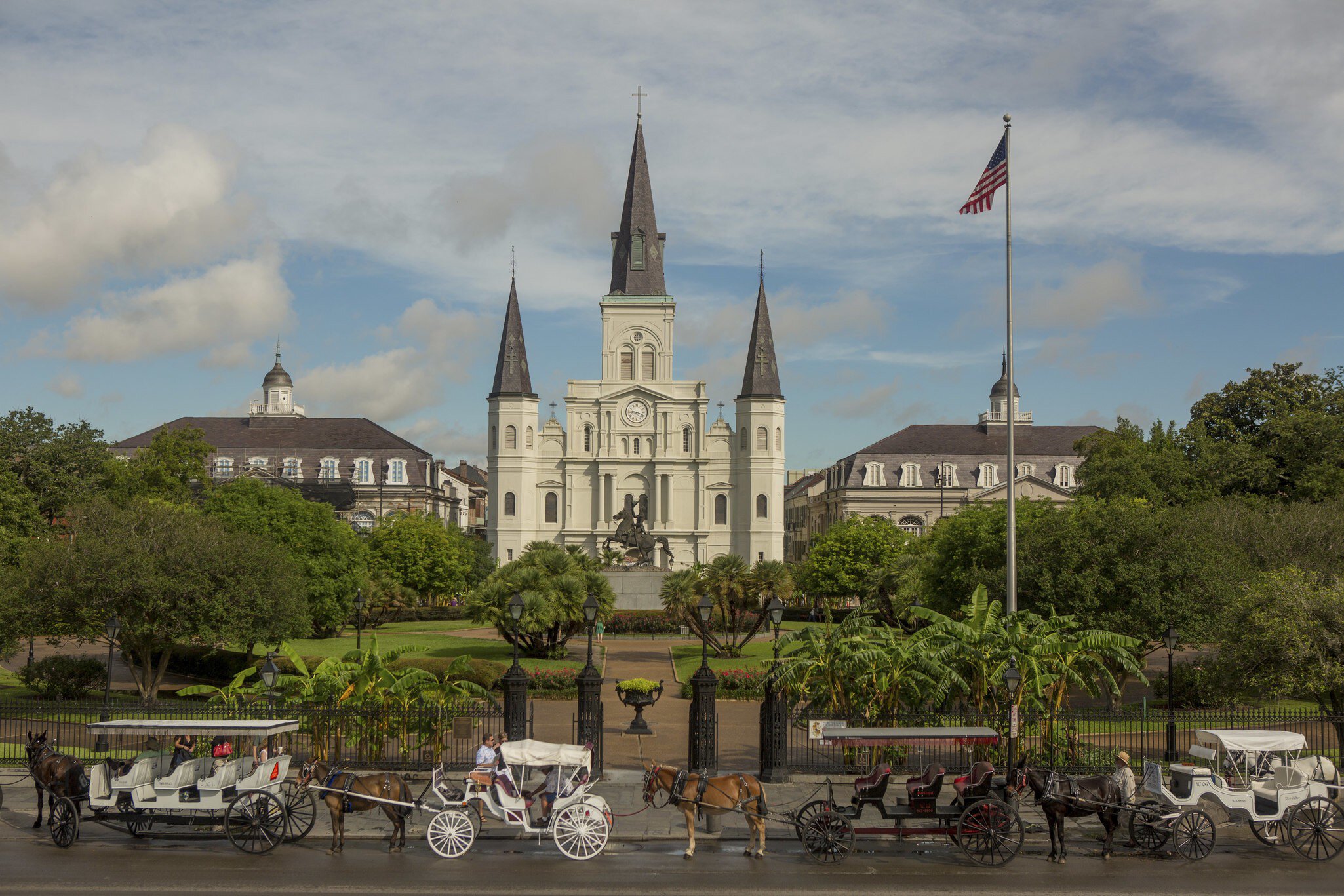 Horse drawn carriages in front of the St. Louis Cathedral in New Orleans, Louisiana.