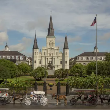 Horse drawn carriages in front of the St. Louis Cathedral in New Orleans, Louisiana.