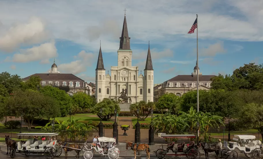 Horse drawn carriages in front of the St. Louis Cathedral in New Orleans, Louisiana.