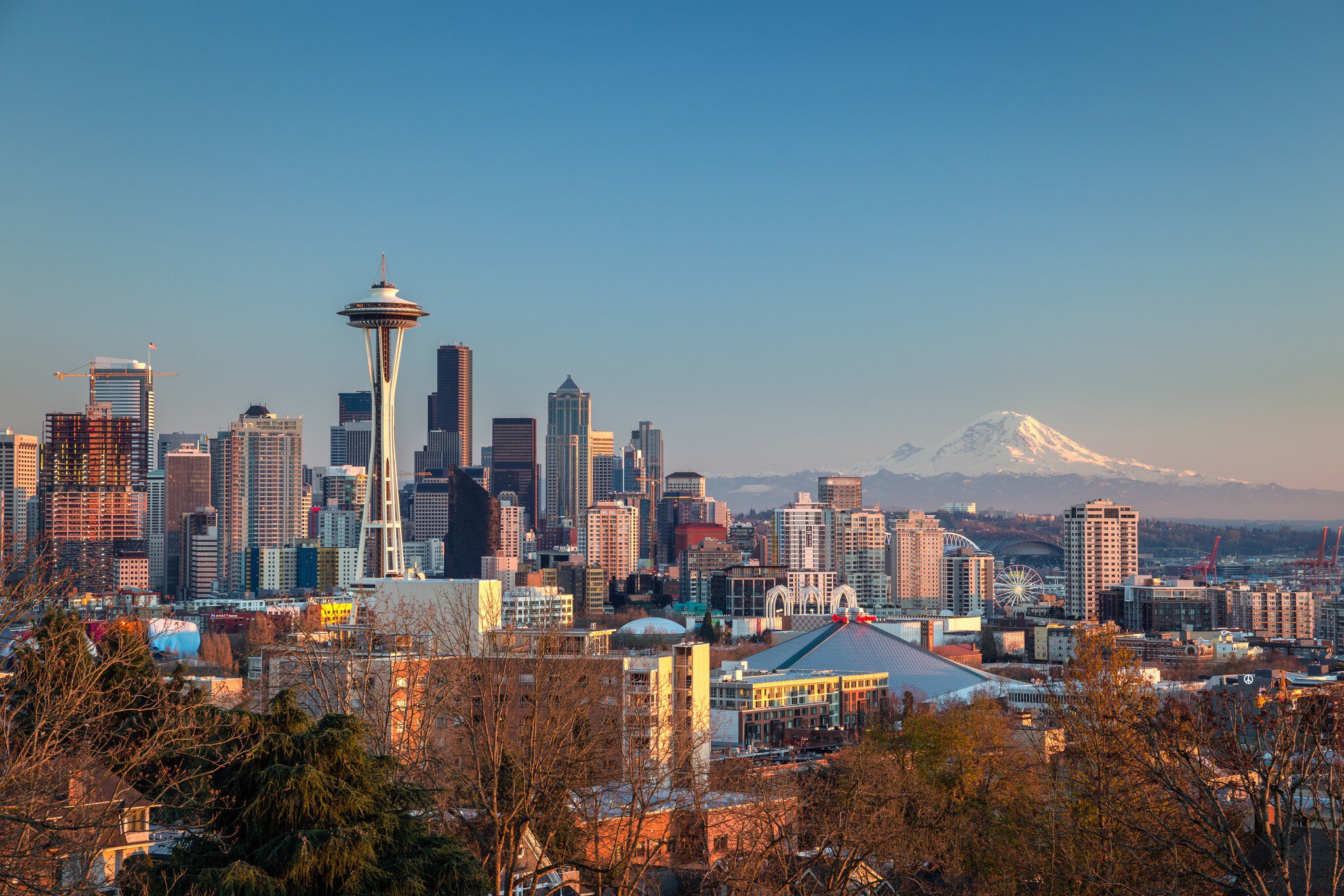 The Seattle city skyline with Mt Rainier beyond.
694083245
Architecture; AutotagHighlyAuthentic - Do Not Delete; Bare Tree; Blue; Building Exterior; Built Structure; Business Finance and Industry; City; Cityscape; Clear Sky; Cold Temperature; Color Image; Day; Downtown District; Famous Place; Futuristic; Growth; High Angle View; Horizon Over Land; Horizontal; Illuminated; Illumination; Modern; Mountain; Mt Rainier; No People; Outdoors; Photography; Seattle; Sky; Skyscraper; Snow; Snowcapped Mountain; Space Needle; Tower; Travel Destinations; Tree; Treetop; Urban Skyline; USA; Washington State;