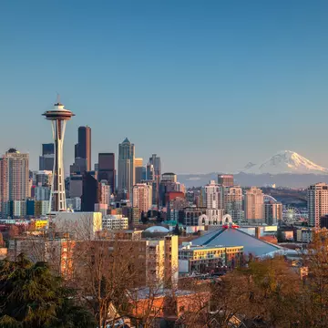 The Seattle city skyline with Mt Rainier beyond.
694083245
Architecture; AutotagHighlyAuthentic - Do Not Delete; Bare Tree; Blue; Building Exterior; Built Structure; Business Finance and Industry; City; Cityscape; Clear Sky; Cold Temperature; Color Image; Day; Downtown District; Famous Place; Futuristic; Growth; High Angle View; Horizon Over Land; Horizontal; Illuminated; Illumination; Modern; Mountain; Mt Rainier; No People; Outdoors; Photography; Seattle; Sky; Skyscraper; Snow; Snowcapped Mountain; Space Needle; Tower; Travel Destinations; Tree; Treetop; Urban Skyline; USA; Washington State;