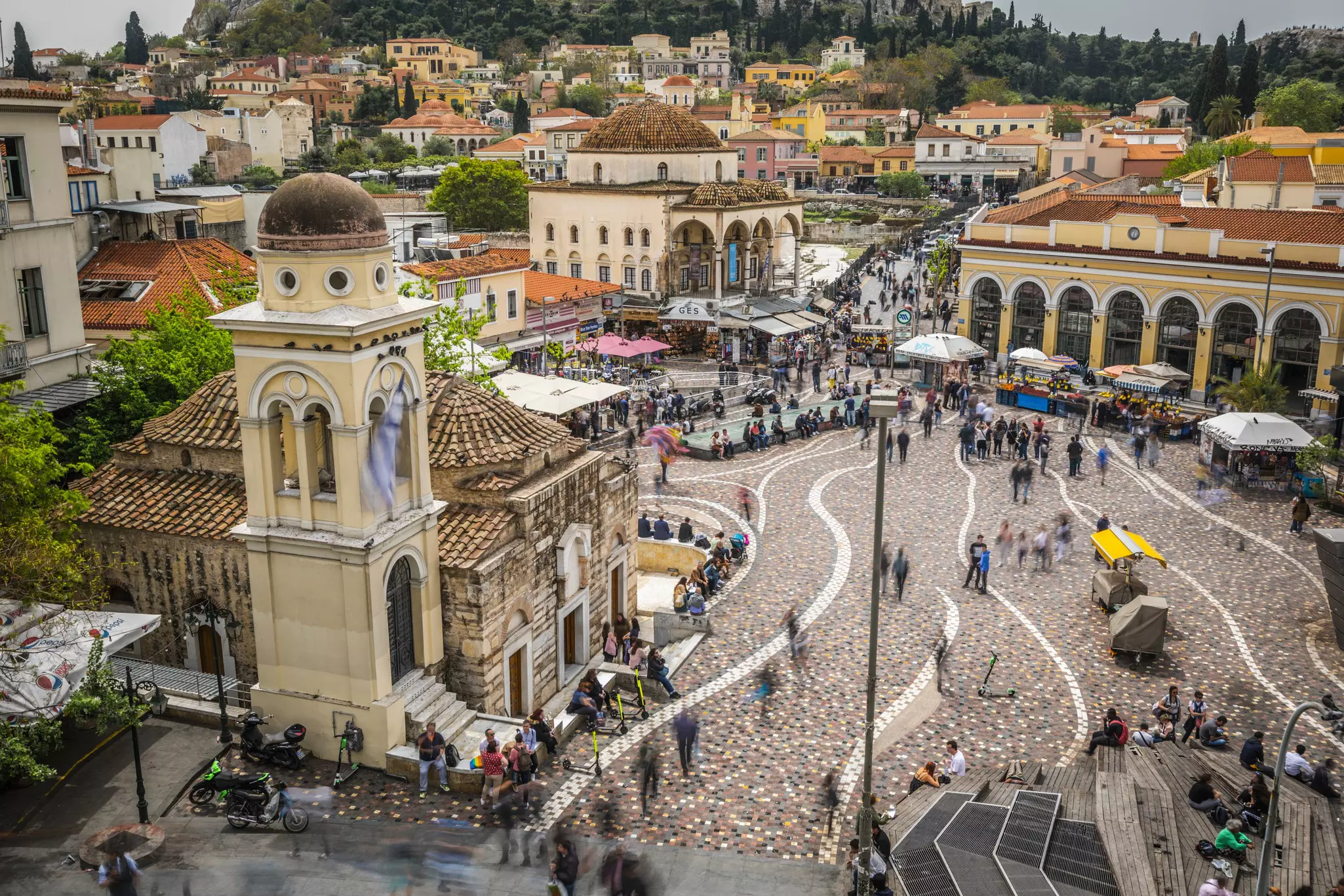 A busy city square with market stalls