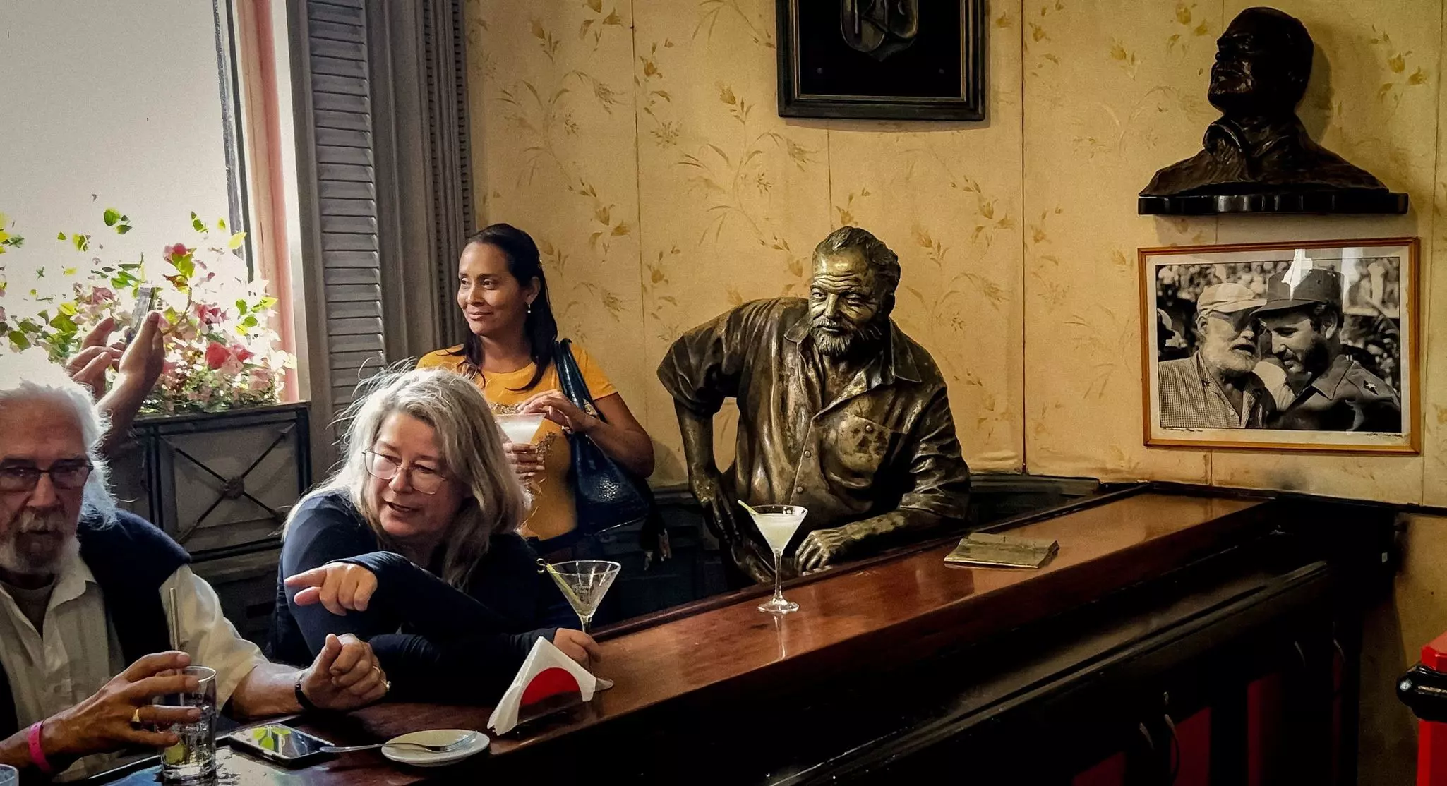 Papa Hemingway looms large at historic El Floridita in central Havana © Adalberto Roque / AFP via Getty Images