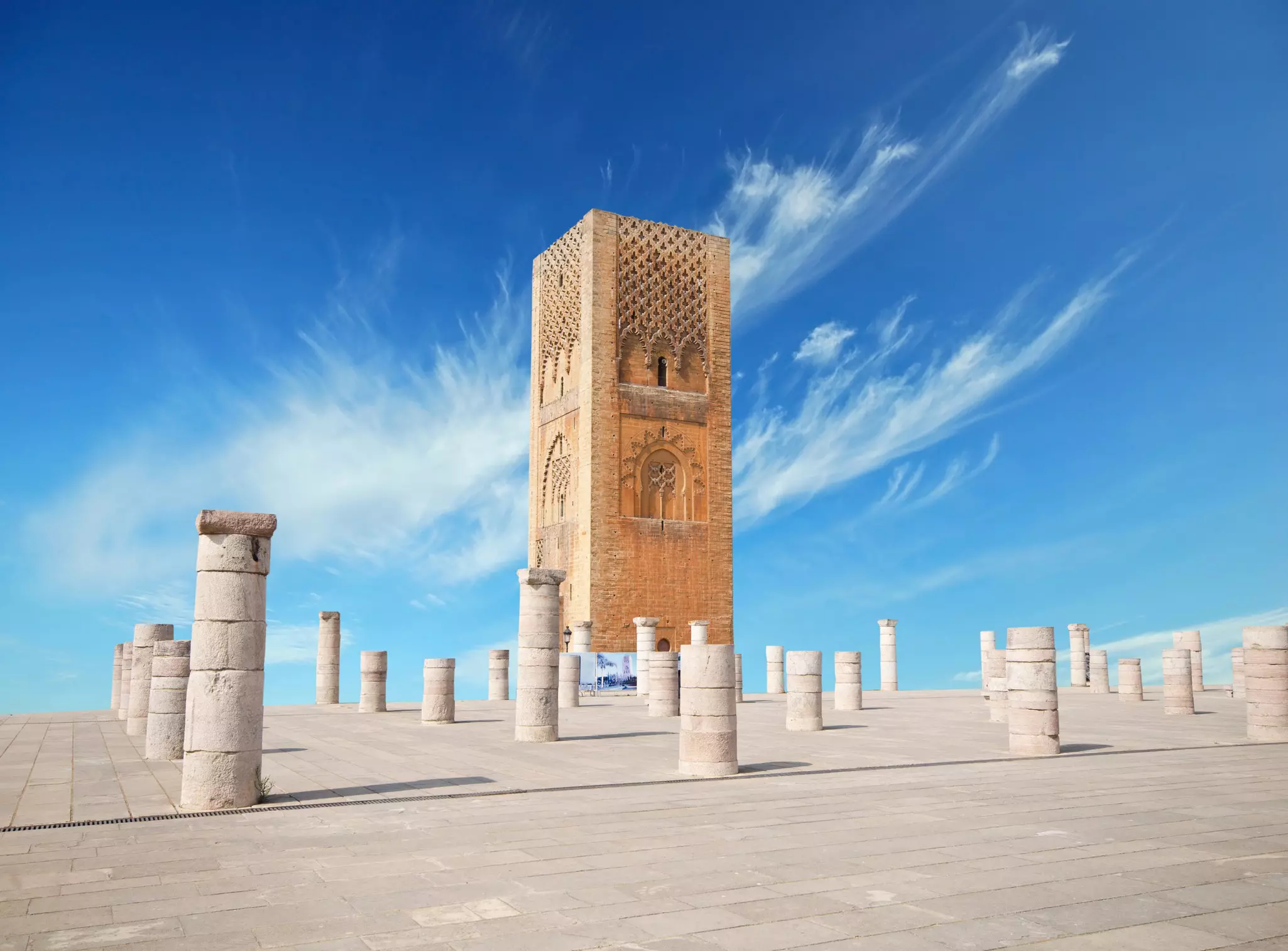 Hassan Tower, made of red sandstones, in a square with stone columns