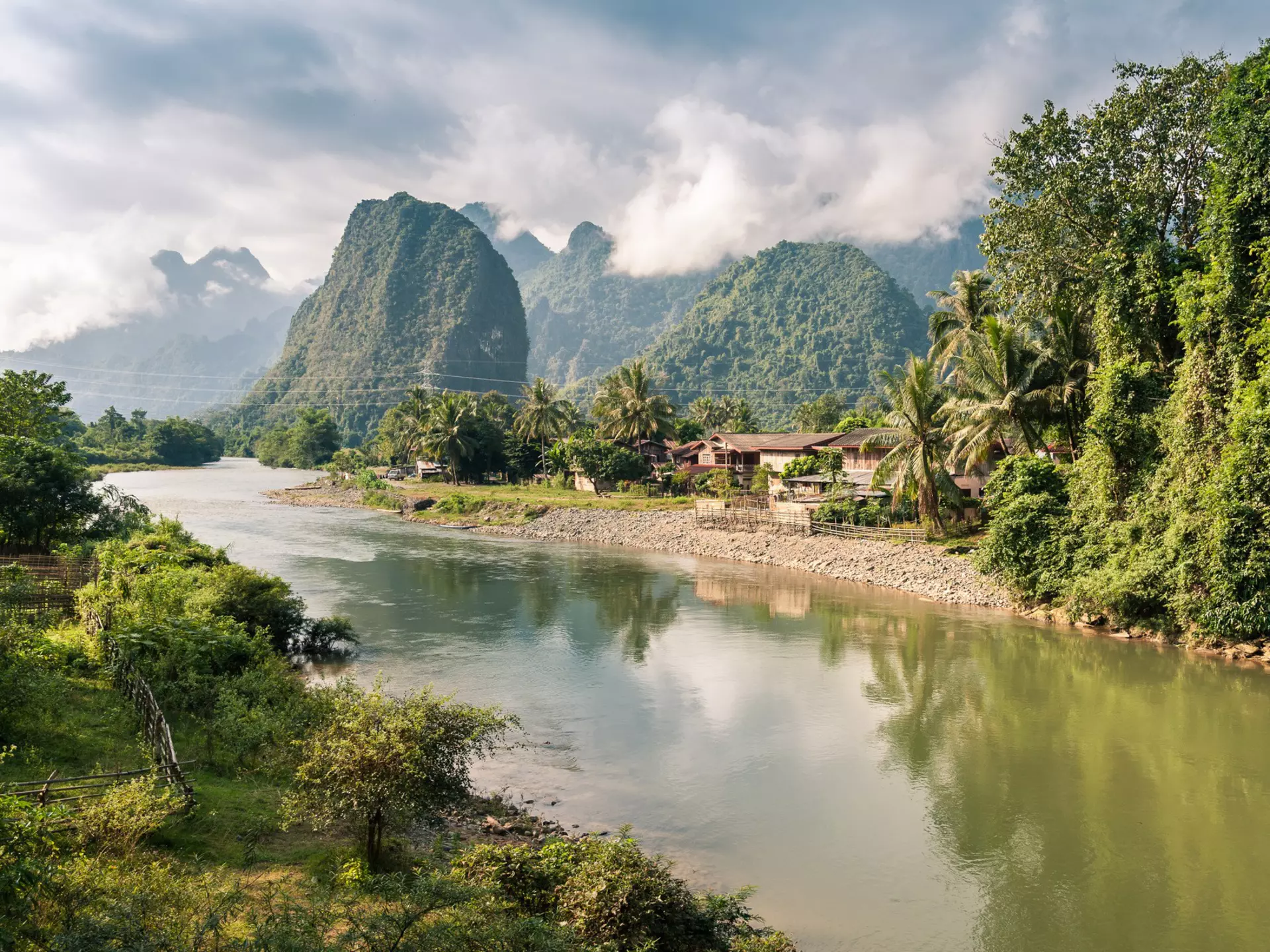 Karst mountains and jungle along a river.