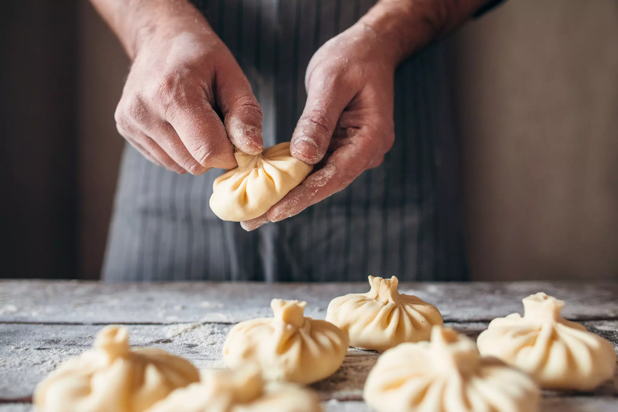 Prepare Georgian specialties including khinkali (meat dumplings) © golubovy / Getty Images