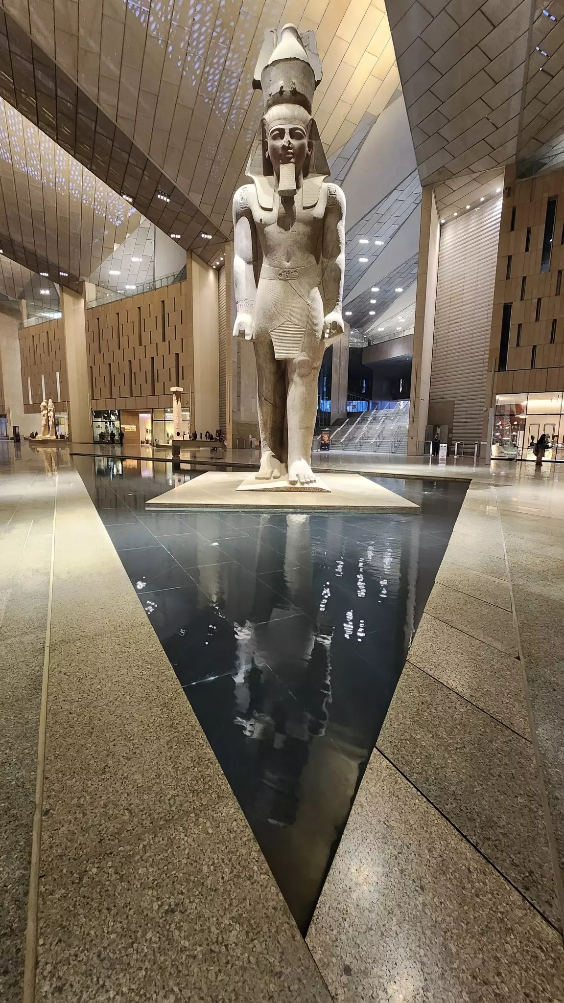 A towering statue of Ramesses II greets visitors to the architectural work of art that is the Grand Egyptian Museum in Giza © Creativity lover / Shutterstock