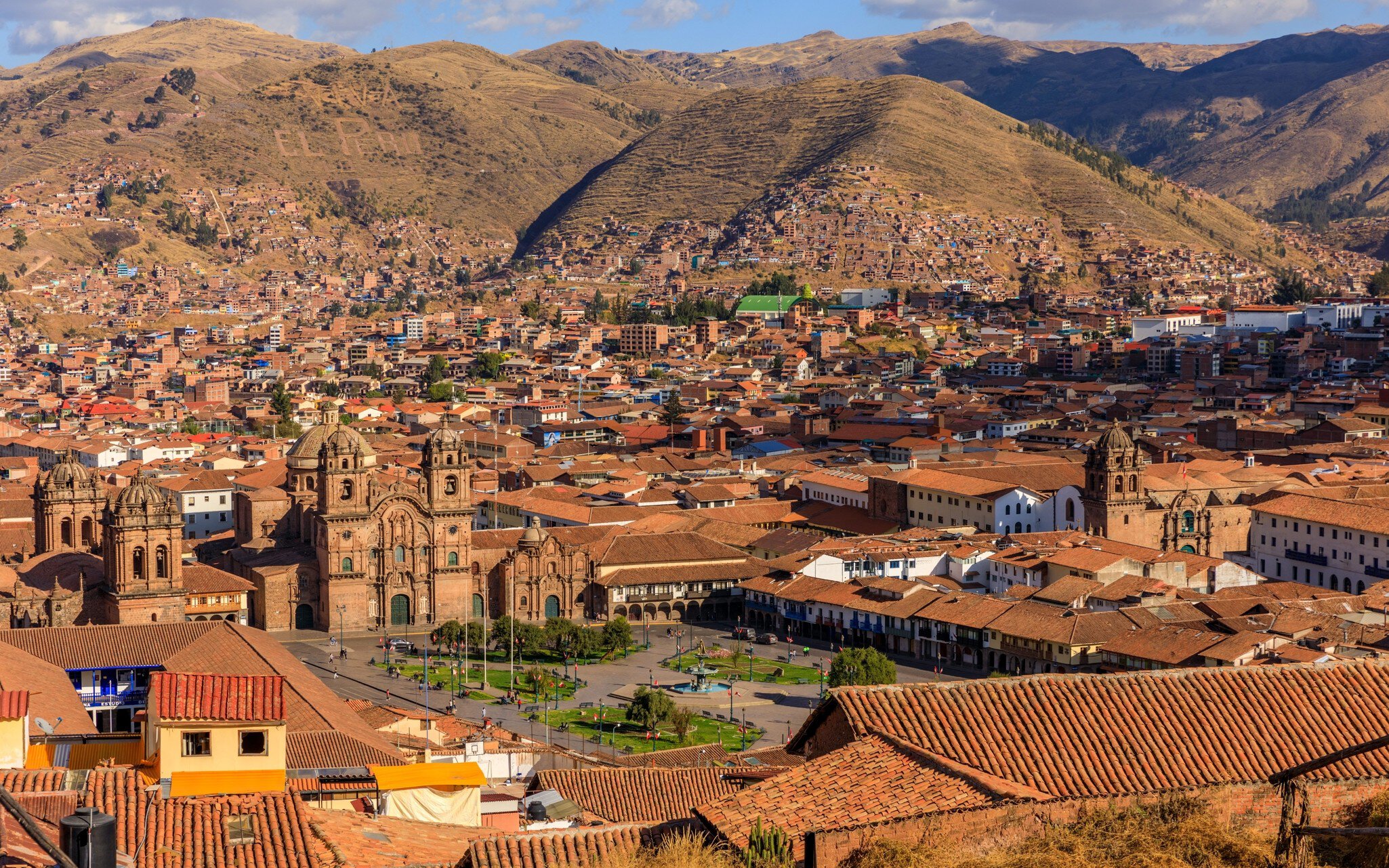 Panoramic view of Cusco, Peru, showcasing historic architecture and surrounding mountains under a clear blue sky., License Type: media, Download Time: 2026-02-26T19:16:09.000Z, User: LP_YKhanna, Editorial: false, purchase_order: 65050 - Digital Destinations and Articles, job: LP, client: Journeys, other: Yuvraj Khanna