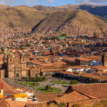 Panoramic view of Cusco, Peru, showcasing historic architecture and surrounding mountains under a clear blue sky., License Type: media, Download Time: 2026-02-26T19:16:09.000Z, User: LP_YKhanna, Editorial: false, purchase_order: 65050 - Digital Destinations and Articles, job: LP, client: Journeys, other: Yuvraj Khanna