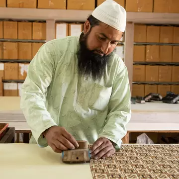 Block-printing process at the Sufiyan Ajrakh Studio in Gujarat, India. 