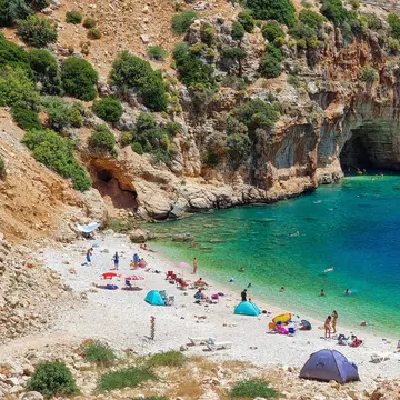 Antalya, Finike, Turkey July 26, 2023: Cave on the Demre - Finike road. Detail of eroded rock. Tourists swim and sunbathe here. Kaş, Antalya, Türkiye, License Type: media, Download Time: 2024-08-02T08:08:23.000Z, User: catalinaaragon, Editorial: true, purchase_order: 56530, job: Global Publishing-WIP, client: Turkey 17, other: CatalinaAragón