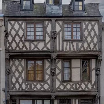 Facade of the acrobats' house (Maison des Acrobates); two corbelled upper storeys with brackets and corbelling. Loire Valley, France.