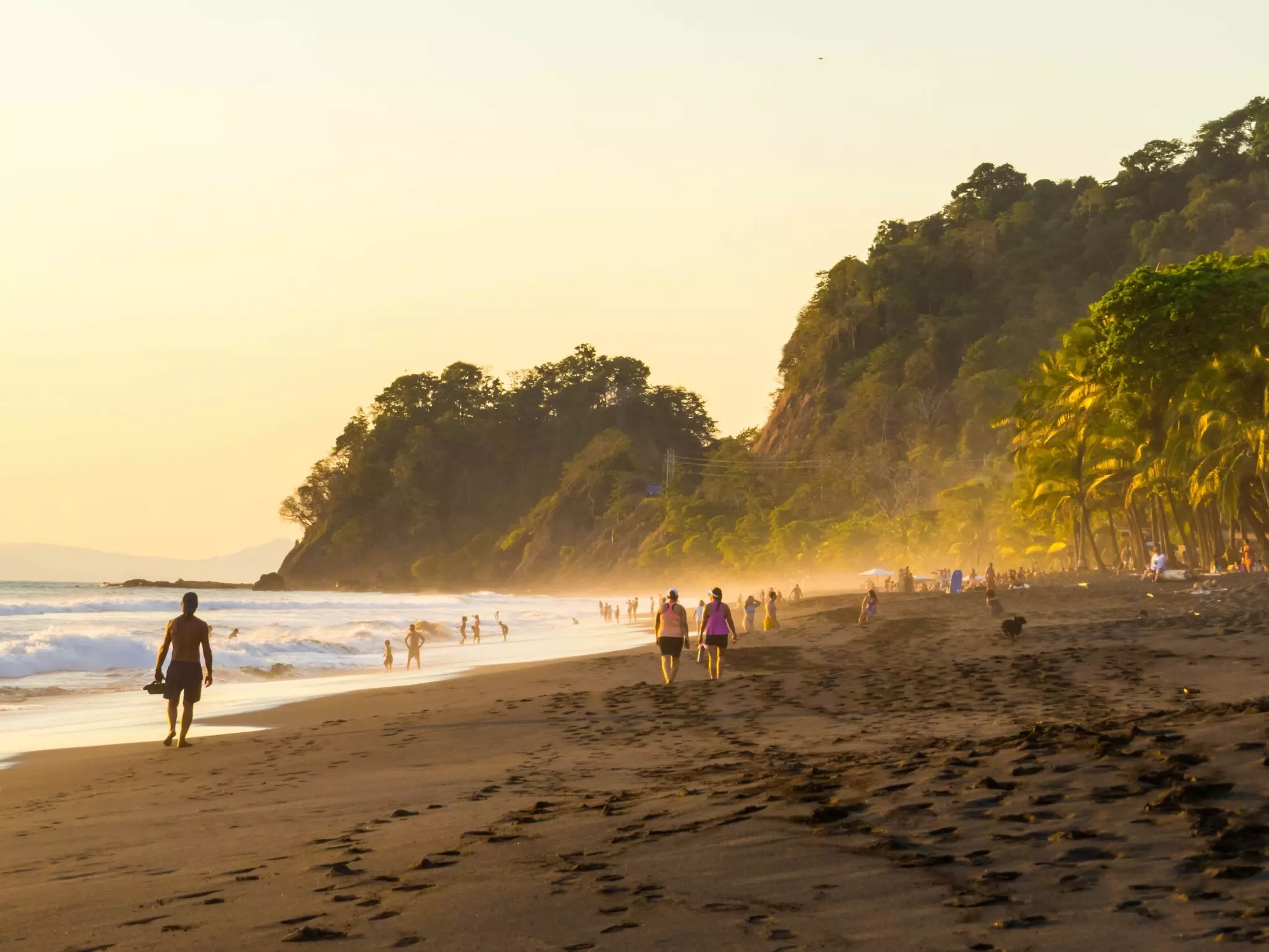 Surfer walking at the beach at Playa Hermosa. Stock Photos 2000/Shutterstock